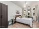 Bright bedroom with tile floors, two large windows, and a desk area at 6846 S 26Th Pl, Phoenix, AZ 85042