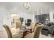 Bright dining area with glass table, seating for four, and views into the living area at 6846 S 26Th Pl, Phoenix, AZ 85042