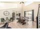 Sun-filled dining area boasting high ceilings, a large window, and a stylish farmhouse table at 6846 S 26Th Pl, Phoenix, AZ 85042