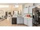 Bright, open kitchen with a view of an adjacent living space with high ceilings and natural light at 6846 S 26Th Pl, Phoenix, AZ 85042