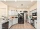 Functional kitchen featuring stainless steel appliances, light cabinetry, and a view into the dining area at 6846 S 26Th Pl, Phoenix, AZ 85042