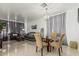 Spacious living room and dining area featuring modern chandelier and neutral tones at 6846 S 26Th Pl, Phoenix, AZ 85042