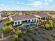 Beautiful aerial view of the backyard featuring a pool, lush landscaping, and outdoor living spaces in a gated community at 7511 S Parkcrest St, Gilbert, AZ 85298