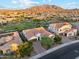 Stunning aerial view of home, showcasing the tile roof, landscaped yard, and mountain views at 7511 S Parkcrest St, Gilbert, AZ 85298