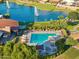 Aerial image of a community pool with a splash pad, playground, and clubhouse perfect for Gathering fun at 7511 S Parkcrest St, Gilbert, AZ 85298