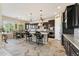 Gourmet kitchen with a large island, pendant lighting, stainless appliances, and eat-in dining area at 7511 S Parkcrest St, Gilbert, AZ 85298