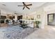 Open-concept living room with a comfortable sofa, decorative rug, and modern finishes at 7511 S Parkcrest St, Gilbert, AZ 85298