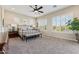Serene main bedroom featuring neutral colors, plantation shutters, and carpet floors at 7511 S Parkcrest St, Gilbert, AZ 85298