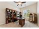 Spacious office featuring custom wood built-ins, sleek desk, and a unique vintage jukebox at 7511 S Parkcrest St, Gilbert, AZ 85298