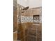 Modern tile shower with rainfall shower head, hand wand, decorative tile and built-in niche at 7511 S Parkcrest St, Gilbert, AZ 85298
