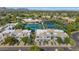 Charming community aerial with tennis courts and manicured lawns offering a vibrant lifestyle at 7710 E Gainey Ranch Rd # 206, Scottsdale, AZ 85258