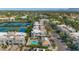 Community aerial view showcases lush landscaping, sparkling pool, tennis courts, and well-maintained homes at 7710 E Gainey Ranch Rd # 206, Scottsdale, AZ 85258