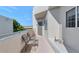 Balcony featuring outdoor seating and a view of the tennis court at 7710 E Gainey Ranch Rd # 206, Scottsdale, AZ 85258