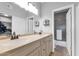 Modern bathroom with dual sinks, large mirror, and shower/tub combo at 7710 E Gainey Ranch Rd # 206, Scottsdale, AZ 85258