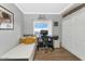 Bright bedroom featuring a modern desk, single bed, and a minimalist design at 7710 E Gainey Ranch Rd # 206, Scottsdale, AZ 85258
