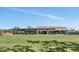 Expansive community center featuring a lawn, outdoor seating, and a modern architectural design at 7710 E Gainey Ranch Rd # 206, Scottsdale, AZ 85258