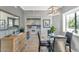Cozy dining area adjacent to the kitchen featuring neutral tones and a round table at 7710 E Gainey Ranch Rd # 206, Scottsdale, AZ 85258