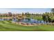 Scenic view of the golf course with lush green fairways, a tranquil lake, and mature trees at 7710 E Gainey Ranch Rd # 206, Scottsdale, AZ 85258