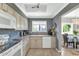 Charming kitchen featuring updated appliances, neutral cabinets, and plenty of natural light at 7710 E Gainey Ranch Rd # 206, Scottsdale, AZ 85258