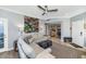 Open-concept living room flowing into the kitchen with comfortable seating and natural light at 7710 E Gainey Ranch Rd # 206, Scottsdale, AZ 85258