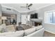 Cozy living room leading to the kitchen, complete with a fireplace and comfortable seating at 7710 E Gainey Ranch Rd # 206, Scottsdale, AZ 85258