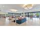 Bright lounge area with large windows, stylish seating, and a cozy atmosphere at 7710 E Gainey Ranch Rd # 206, Scottsdale, AZ 85258