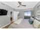 Comfortable main bedroom with balcony access, ensuite bath, and calming wall color at 7710 E Gainey Ranch Rd # 206, Scottsdale, AZ 85258
