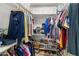 Spacious walk-in closet with custom shelving and ample storage for clothes and shoes at 7710 E Gainey Ranch Rd # 206, Scottsdale, AZ 85258