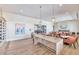 Elegant wine room with tasting table, decorative lighting, and a modern fireplace at 7710 E Gainey Ranch Rd # 206, Scottsdale, AZ 85258