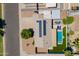 Aerial view of a home with solar panels, a pool, and well-maintained landscaping at 823 N 81St St, Mesa, AZ 85207