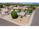 Aerial view of a charming home with desert landscaping and mature shade trees at 823 N 81St St, Mesa, AZ 85207