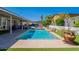 Backyard showcasing a refreshing pool, covered patio, and beautiful landscaping for outdoor living at 823 N 81St St, Mesa, AZ 85207