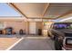 A covered carport with a classic black truck parked inside offers practical shelter and parking at 823 N 81St St, Mesa, AZ 85207