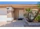 Inviting front entry with a decorative door, well-kept landscaping, and a clear house number at 823 N 81St St, Mesa, AZ 85207