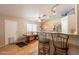 Bright kitchen featuring a dining table, stainless steel appliances, and counter seating at the breakfast bar at 823 N 81St St, Mesa, AZ 85207