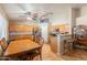 Well-lit kitchen with a dining table, stainless steel appliances, and a breakfast bar for seating at 823 N 81St St, Mesa, AZ 85207