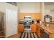 Bright kitchen features stainless steel appliances, wooden cabinets, and stylish black and white mat at 823 N 81St St, Mesa, AZ 85207