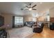 Spacious living room featuring a cozy leather seating arrangement and a dining area nearby at 823 N 81St St, Mesa, AZ 85207