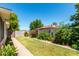 Beautiful backyard with green lawn, landscaping, and a privacy fence, creating a serene outdoor space at 840 E 2Nd St, Mesa, AZ 85203