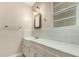A bathroom featuring a sink with white cabinetry, a window with natural light, and traditional fixtures at 840 E 2Nd St, Mesa, AZ 85203