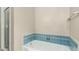 A vintage-style bathroom with blue tile accents and classic fixtures for a nostalgic charm at 840 E 2Nd St, Mesa, AZ 85203