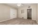 A comfy bedroom with a ceiling fan, closet, and window, offering a relaxing atmosphere at 840 E 2Nd St, Mesa, AZ 85203