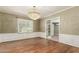 Elegant dining room with a dazzling chandelier and detailed molding at 840 E 2Nd St, Mesa, AZ 85203