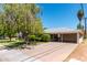 Well-manicured front yard with mature trees and carport at 840 E 2Nd St, Mesa, AZ 85203