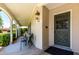 Charming front porch with seating area, columns, and attractive front door at 840 E 2Nd St, Mesa, AZ 85203