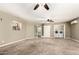 An expansive living room showcasing a laundry area and french doors at 840 E 2Nd St, Mesa, AZ 85203