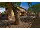 View of a backyard featuring desert landscaping, an extended covered patio, and an open pergola at 8503 W Coyote Dr, Peoria, AZ 85383