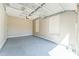 Garage with epoxy floor, door to house and windows at 8503 W Coyote Dr, Peoria, AZ 85383