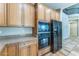Bright kitchen with wooden cabinetry, stainless steel appliances, and ample counter space for meal preparation at 8503 W Coyote Dr, Peoria, AZ 85383