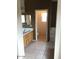 Bathroom featuring a single vanity with wood cabinets, mirror, tile floors and a bathtub/shower combo at 1015 S Val Vista Dr # 8, Mesa, AZ 85204